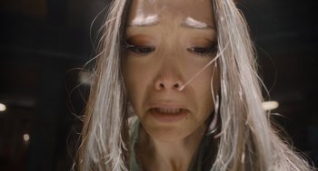 Movie still from “Guardians of the Galaxy Vol. 3” (2023), directed by James Gunn – A person with long white hair; Extreme Close Up shot, Overhead angle