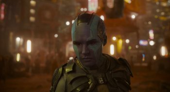 Movie still from “Guardians of the Galaxy Vol. 3” (2023), directed by James Gunn – A man with a helmet is standing in the dark; Close Up shot, Over the shoulder angle