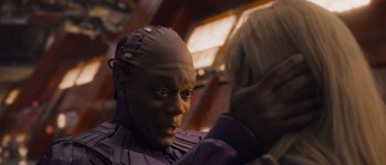 Movie still from “Guardians of the Galaxy Vol. 3” (2023), directed by James Gunn – A man in a purple shirt is looking at the camera; Close Up shot, Over the shoulder angle