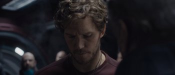 Movie still from “Guardians of the Galaxy Vol. 3” (2023), directed by James Gunn – A person wearing a necklace; Close Up shot, High angle