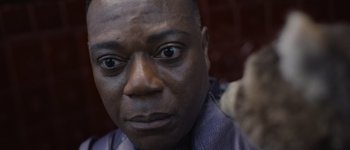 Movie still from “Guardians of the Galaxy Vol. 3” (2023), directed by James Gunn – A man's face in a purple shirt; Close Up shot, High angle