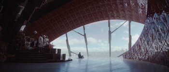 Movie still from “Guardians of the Galaxy Vol. 3” (2023), directed by James Gunn – A person sitting on the floor of a building; Extreme Wide shot, Low angle