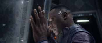 Movie still from “Guardians of the Galaxy Vol. 3” (2023), directed by James Gunn – A man with his hands up and his eyes closed; Close Up shot, High angle