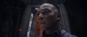 Movie still from “Guardians of the Galaxy Vol. 3” (2023), directed by James Gunn – A person wearing a suit; Close Up shot, Low angle