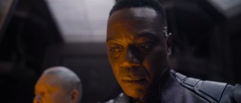 Movie still from “Guardians of the Galaxy Vol. 3” (2023), directed by James Gunn – A man's face in a dark room; Close Up shot, Low angle