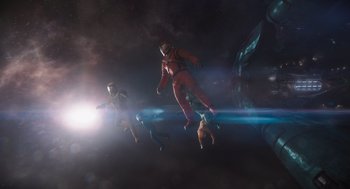 Movie still from “Guardians of the Galaxy Vol. 3” (2023), directed by James Gunn – A group of people flying through the air in space; Extreme Wide shot, Overhead angle
