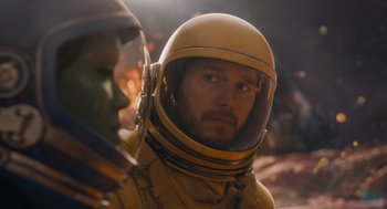 Movie still from “Guardians of the Galaxy Vol. 3” (2023), directed by James Gunn – A man in a yellow space suit and helmet; Close Up shot, Over the shoulder angle