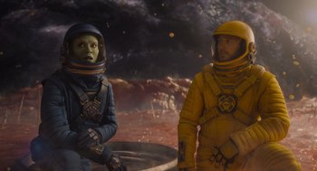 Movie still from “Guardians of the Galaxy Vol. 3” (2023), directed by James Gunn – Two people in space suits standing next to each other; Medium shot, Over the shoulder angle