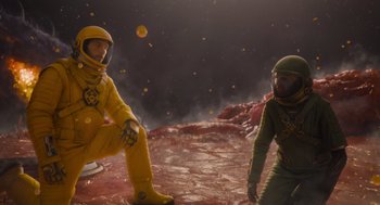 Movie still from “Guardians of the Galaxy Vol. 3” (2023), directed by James Gunn – Two people in space suits are standing on a red planet; Wide shot, Low angle