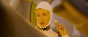 Movie still from “Guardians of the Galaxy Vol. 3” (2023), directed by James Gunn – A woman in a space suit holding a device in front of her face; Close Up shot, Low angle