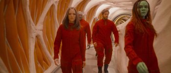 Movie still from “Guardians of the Galaxy Vol. 3” (2023), directed by James Gunn – A group of people walking down a hallway; Wide shot, Low angle