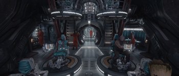 Movie still from “Guardians of the Galaxy Vol. 3” (2023), directed by James Gunn – A group of people standing inside of a building; Wide shot, High angle