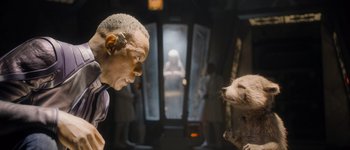 Movie still from “Guardians of the Galaxy Vol. 3” (2023), directed by James Gunn – A man's face and a dog's face; Close Up shot, Over the shoulder angle