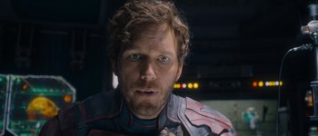 Movie still from “Guardians of the Galaxy Vol. 3” (2023), directed by James Gunn – A person wearing a helmet; Close Up shot, Over the shoulder angle