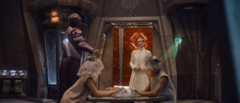 Movie still from “Guardians of the Galaxy Vol. 3” (2023), directed by James Gunn – A group of people standing in front of a woman; Medium shot, Over the shoulder angle