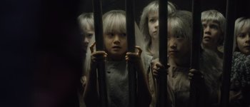 Movie still from “Guardians of the Galaxy Vol. 3” (2023), directed by James Gunn – A group of young children behind bars in a dark room; Close Up shot, High angle