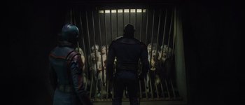 Movie still from “Guardians of the Galaxy Vol. 3” (2023), directed by James Gunn – A group of people standing in front of a jail cell; Wide shot, High angle