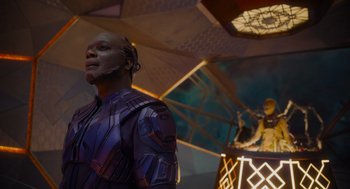 Movie still from “Guardians of the Galaxy Vol. 3” (2023), directed by James Gunn – A man standing next to another man in a room; Medium shot, Low angle