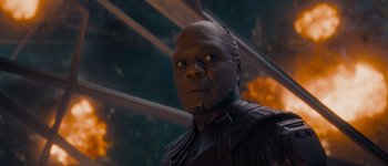 Movie still from “Guardians of the Galaxy Vol. 3” (2023), directed by James Gunn – A man in a black jacket and a red mask; Close Up shot, Low angle