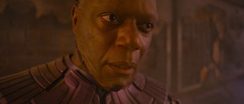 Movie still from “Guardians of the Galaxy Vol. 3” (2023), directed by James Gunn – A man's face in a purple outfit; Close Up shot, Low angle