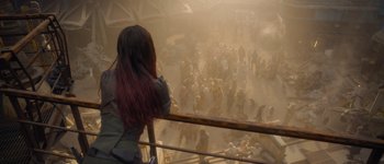 Movie still from “Guardians of the Galaxy Vol. 3” (2023), directed by James Gunn – A crowd of people standing in a building; Wide shot, Over the shoulder angle
