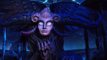 Movie still from “Guillermo del Toro's Pinocchio” (2022), directed by Guillermo del Toro – A statue of an angel wearing a mask and horns; Medium shot, Low angle