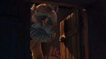 Movie still from “Guillermo del Toro's Pinocchio” (2022), directed by Guillermo del Toro – An animated character is looking out of a door; Medium shot, Low angle