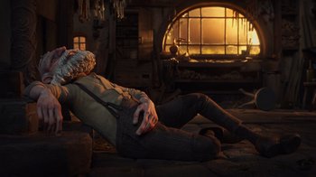 Movie still from “Guillermo del Toro's Pinocchio” (2022), directed by Guillermo del Toro – A man laying on the ground in front of a fire place; Wide shot, Low angle