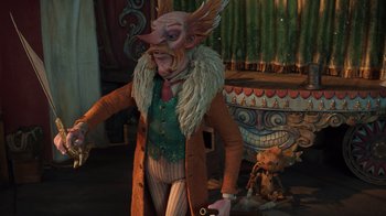 Movie still from “Guillermo del Toro's Pinocchio” (2022), directed by Guillermo del Toro – A man in a costume with a fake head; Medium shot, Low angle