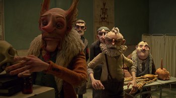 Movie still from “Guillermo del Toro's Pinocchio” (2022), directed by Guillermo del Toro – A group of people standing around in a room; Medium shot, Low angle
