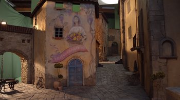 Movie still from “Guillermo del Toro's Pinocchio” (2022), directed by Guillermo del Toro – An alley way with a mural on the side of the building; Extreme Wide shot, Low angle