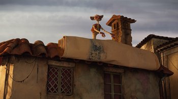 Movie still from “Guillermo del Toro's Pinocchio” (2022), directed by Guillermo del Toro – An animated character on top of an old building; Wide shot, Low angle