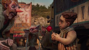 Movie still from “Guillermo del Toro's Pinocchio” (2022), directed by Guillermo del Toro – A man holding a red apple next to a puppet; Wide shot, Low angle
