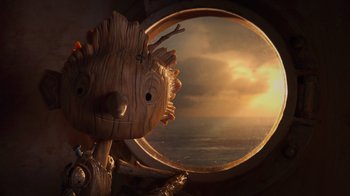 Movie still from “Guillermo del Toro's Pinocchio” (2022), directed by Guillermo del Toro – An image of the ocean through a window; Close Up shot, Low angle