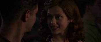 Movie still from “Hacksaw Ridge” (2016), directed by Mel Gibson – A person with curly red hair; Close Up shot, Over the shoulder angle