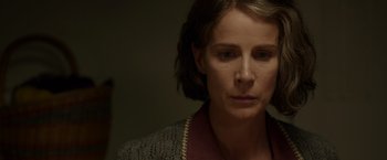 Movie still from “Hacksaw Ridge” (2016), directed by Mel Gibson – A person wearing a sweater; Close Up shot, Over the shoulder angle