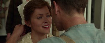 Movie still from “Hacksaw Ridge” (2016), directed by Mel Gibson – A man and a woman smiling at each other; Close Up shot, Over the shoulder angle