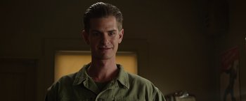 Movie still from “Hacksaw Ridge” (2016), directed by Mel Gibson – A person wearing a green shirt; Close Up shot, Low angle