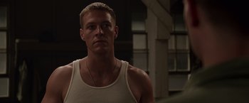 Movie still from “Hacksaw Ridge” (2016), directed by Mel Gibson – A person wearing a tank top; Close Up shot, Low angle