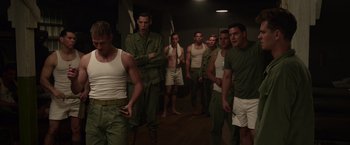 Movie still from “Hacksaw Ridge” (2016), directed by Mel Gibson – A group of men standing next to each other in army fatigues; Medium shot, Low angle