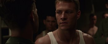 Movie still from “Hacksaw Ridge” (2016), directed by Mel Gibson – A person wearing a white shirt; Close Up shot, Over the shoulder angle