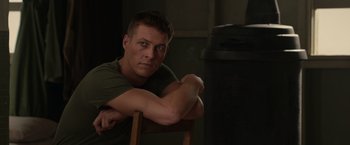 Movie still from “Hacksaw Ridge” (2016), directed by Mel Gibson – A person sitting in a chair; Close Up shot, Over the shoulder angle