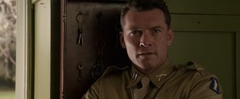 Movie still from “Hacksaw Ridge” (2016), directed by Mel Gibson – A person wearing a uniform; Close Up shot, Low angle