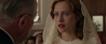 Movie still from “Hacksaw Ridge” (2016), directed by Mel Gibson – A person wearing a veil; Close Up shot, Over the shoulder angle