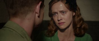 Movie still from “Hacksaw Ridge” (2016), directed by Mel Gibson – A woman looking at a man in the mirror; Close Up shot, Over the shoulder angle