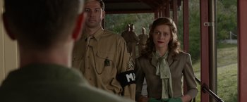 Movie still from “Hacksaw Ridge” (2016), directed by Mel Gibson – A man and a woman dressed in military uniforms; Medium shot, Over the shoulder angle