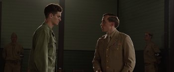Movie still from “Hacksaw Ridge” (2016), directed by Mel Gibson – Two men in military uniforms talking to each other; Medium shot, Over the shoulder angle