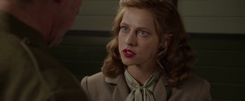 Movie still from “Hacksaw Ridge” (2016), directed by Mel Gibson – A person wearing a suit and tie; Close Up shot, Over the shoulder angle