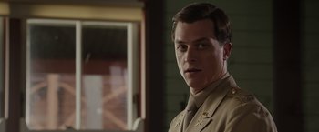 Movie still from “Hacksaw Ridge” (2016), directed by Mel Gibson – A person wearing a uniform; Close Up shot, Over the shoulder angle