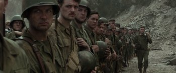 Movie still from “Hacksaw Ridge” (2016), directed by Mel Gibson – A group of men standing next to each other in military uniforms; Medium shot, High angle